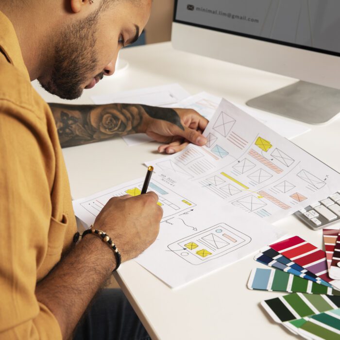 high-angle-man-designing-websites high-angle-man-designing-websites